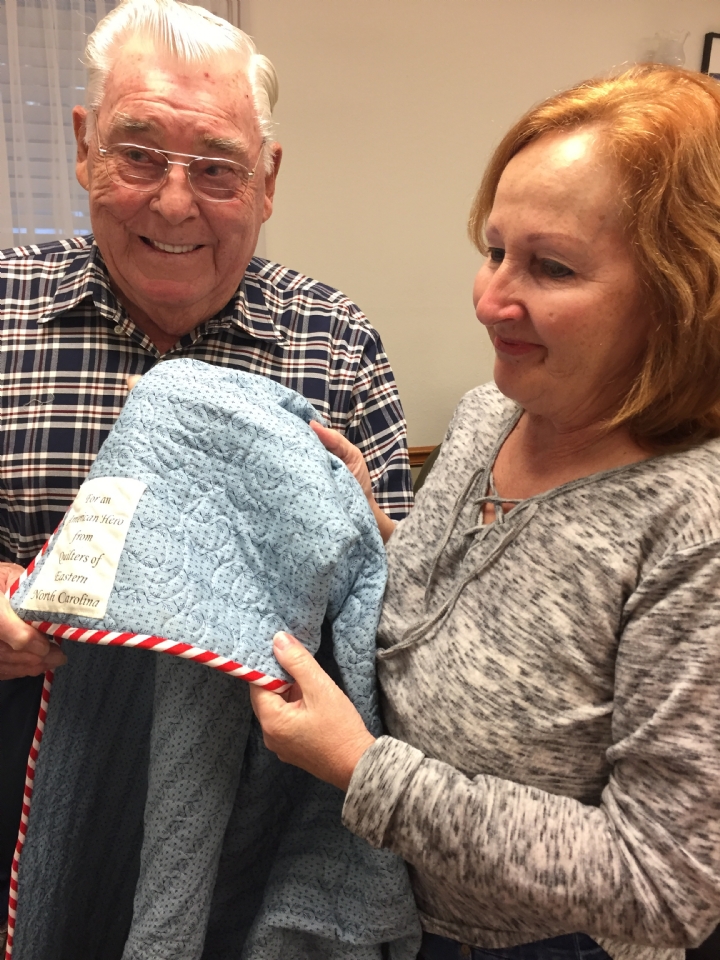 Jim Quigley was awarded a Quilt of Valor from Cathy Elliott. The QOVF began in 2003.  As of March 11, 2018, 182,257 quilts have been awarded. 